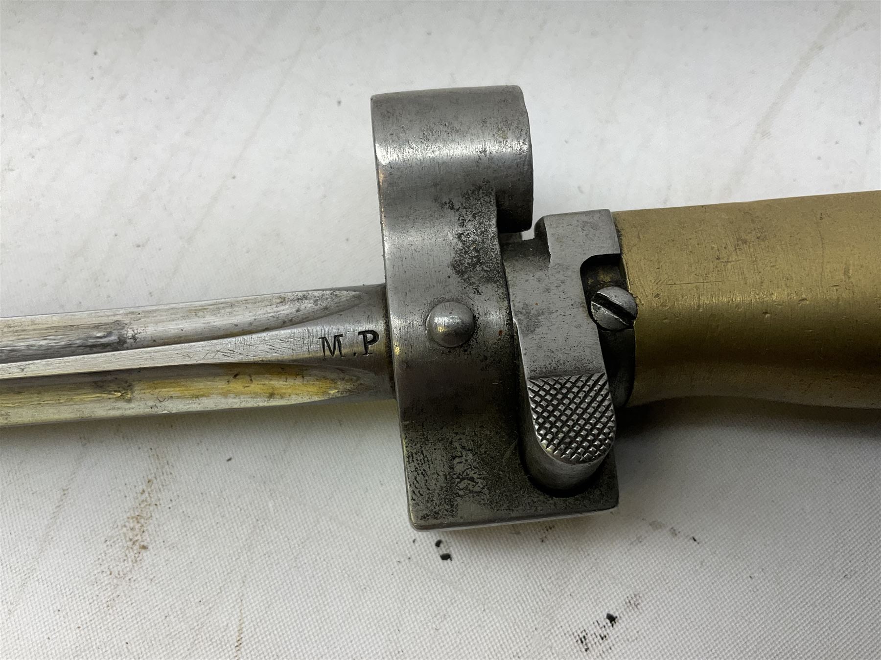 French Lebel Model 1886/93/16 bayonet with 52cm steel cruciform blade and brass hilt No.R22136; in steel tapering round scabbard numbered A62918 L65.5cm overall