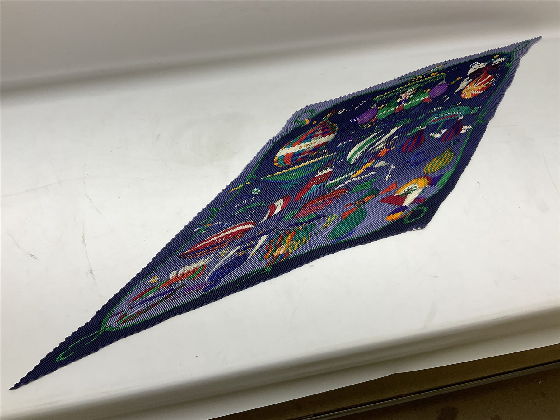 Hermès 'Les Folies Du Ciel' plisse silk scarf, designed by Loïc Dubigeon, printed with hot air balloon motifs, contained within twisted green rope border, on merging light and navy blue ground, with rolled hand stitched edges and Hermes material label, length 129cm