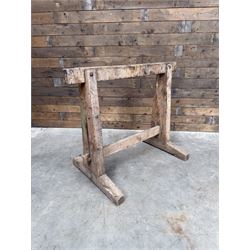 Pair of late 19th century pitch pine trestles, square tapering form in stripped finish