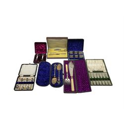 Collection of silver plated items, comprising fish servers, mother of pearl napkin rests, napkin rings, dessert forks, coffee bean spoons and berry spoons, all within tooled leather fitted cases 