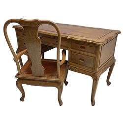 Hong Kong hardwood desk, shaped moulded top over four drawers, shaped aprons carved with scrolls, on shell carved cabriole supports; together with matching elbow chair