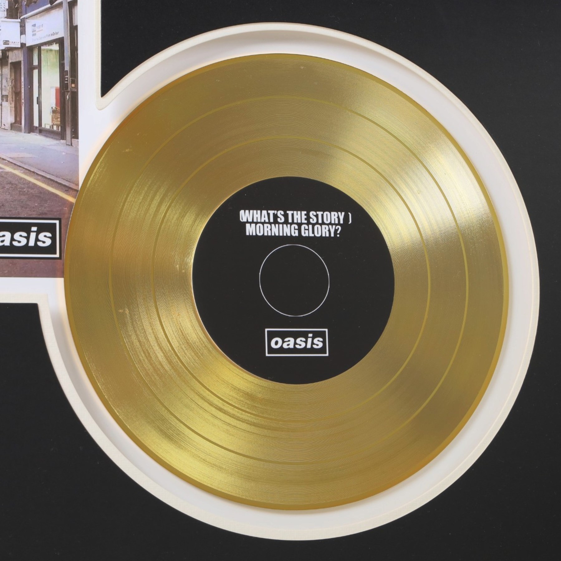 Oasis What's The Story Morning Glory? commemorative gold disc display, featuring gold coloured record, album artwork and track listing, framed and glazed, H40cm, W60cm