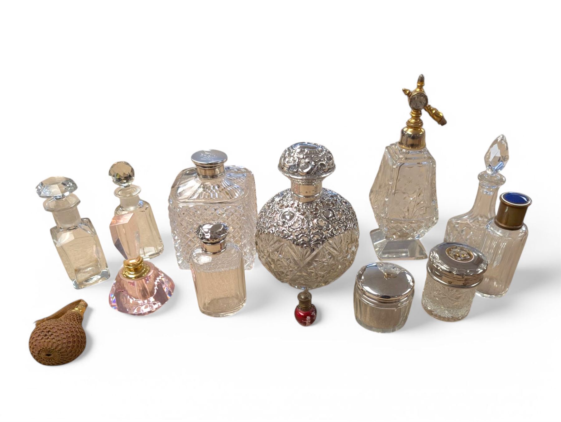 Collection of perfume bottles, including cut glass, silver mounted, coloured glass and miniature examples, tallest H