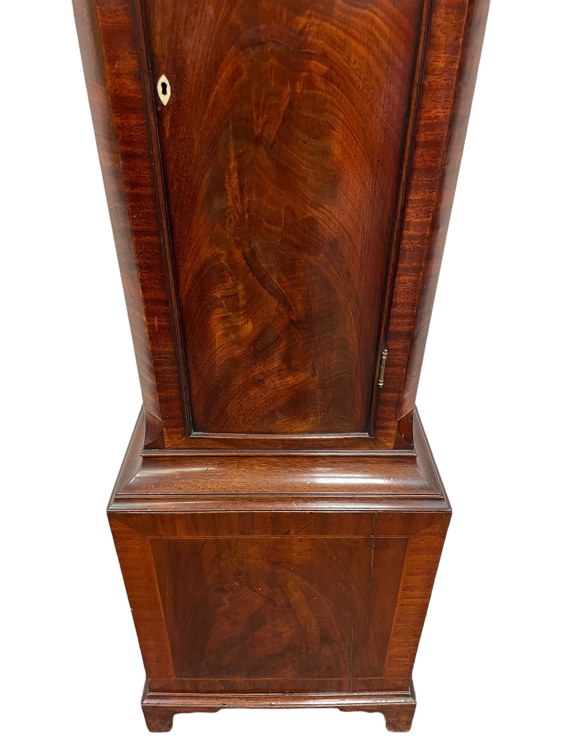 Denton & Fox of Hull – Early 19th century mahogany 8-day longcase clock c1802, pagoda pediment with an oval inlay and three ball and spire finials, break arch painted dial and hood door flanked by reeded pilasters with brass Corinthian capitals, long trunk door with conforming break arch top on a rectangular plinth raised on bracket feet, early Wilson (Birmingham) dial with Roman numerals, five minute Arabic’s and minute dots, subsidiary seconds dial and calendar aperture, with matching steel hands, floral spandrels within raised gesso work and a conforming oval depiction of a young maiden and dog to the break arch, dial pinned via a falseplate to a rack striking movement with a recoil anchor escapement striking the hours on a cast bell. With pendulum and weights.
Joseph Denton was a respected and prolific Hull clock maker working in Scale Lane Hull 1779 and Silver Street 1782-1814. Entering a short-lived partnership with Charles Fox from Beverley in 1802.
