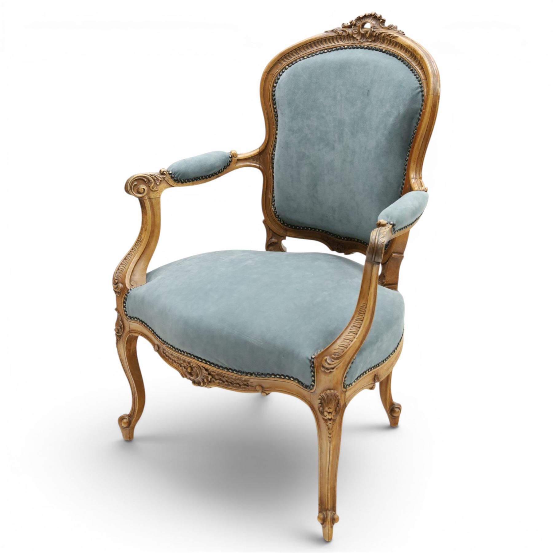 Louis XV design giltwood open armchair, shaped upholstered back with carved foliate cresting, padded scroll arms and serpentine seat upholstered in pale blue fabric with studwork, moulded and foliate carved frame, on cabriole supports with scroll feet