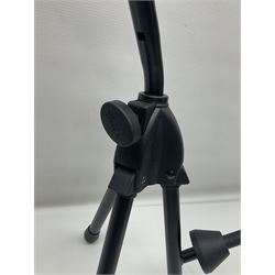 Four folding tubular guitar stands, two by RockJam; and folding tubular saxophone stand (5)