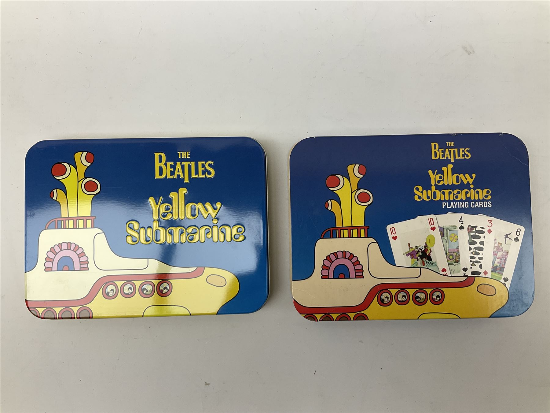 Special edition The Beatles Yellow Submarine playing cards, unopened with gilt edging in a metal tin, together with 1999 McFarlane Toys figures of Yellow Submarine John Lennon and Jeremy Hillary Boob, PH. D, tallest figure 19.5cm 