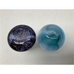 Three millefiori paperweights, together with a green glass dump paperweight with air bubble inclusions, Caithness Daisy and Cauldron paperweights and two small Caithness glass vases, tallest H9cm