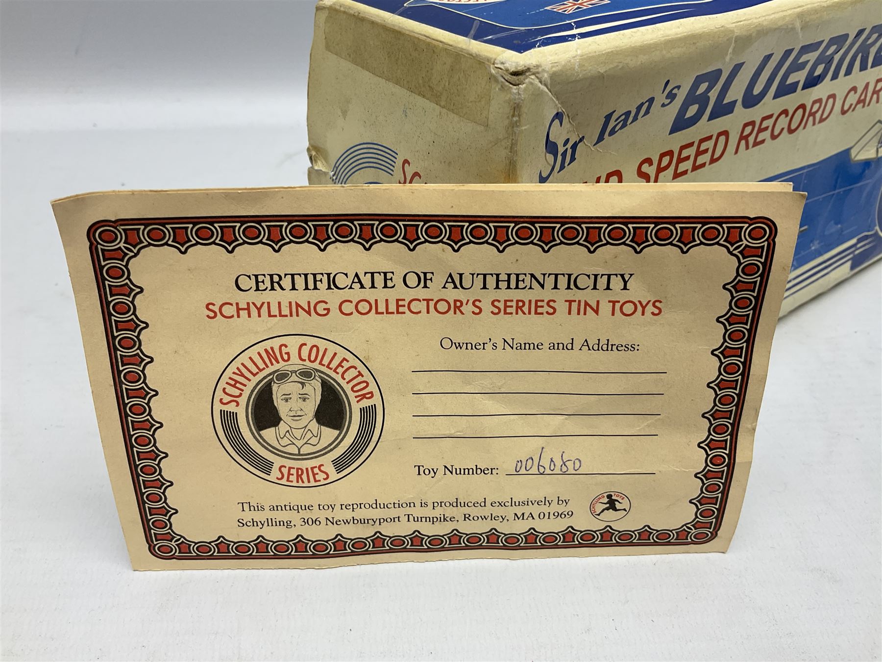 Schylling Collector Series clockwork tin-plate Sir Ian's Bluebird Land Speed Record Car with key and paperwork No.006080; boxed; and clockwork silvered tin-plate model of an 0-6-0 locomotive; unboxed (2)