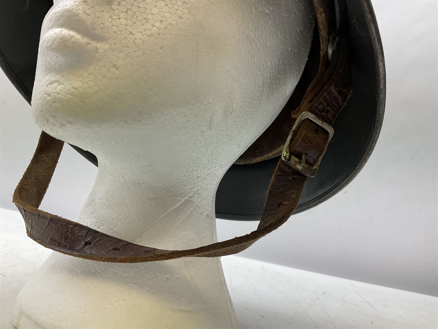WW2 German steel helmet painted in undecaled Luftwaffe bluey grey with leather liner and chin strap stamped '58', the skirt impressed '1250'