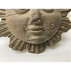 Carved pine mask of the sun, probably late 17th/early 18th century, originally a cresting, bearing Christie's lot labels, D20cm

Provenance 
Lot 161, Christopher Howe - The First Twenty Years, Christie's. 24th March 2004
