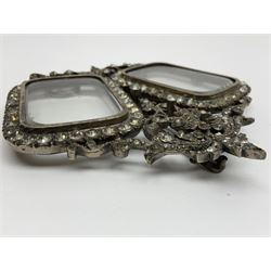 Early 19th century silver plated double photograph frame, each rounded rectangular aperture surrounded by a paste border, with ornate scroll feet and mantling also set with clear paste stones, with easel style support verso, H12cm