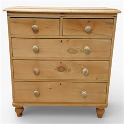 Victorian pine chest of drawers, with rounded top over two short and three long drawers fitted with turned wooden knob handles, raised on turned bun feet