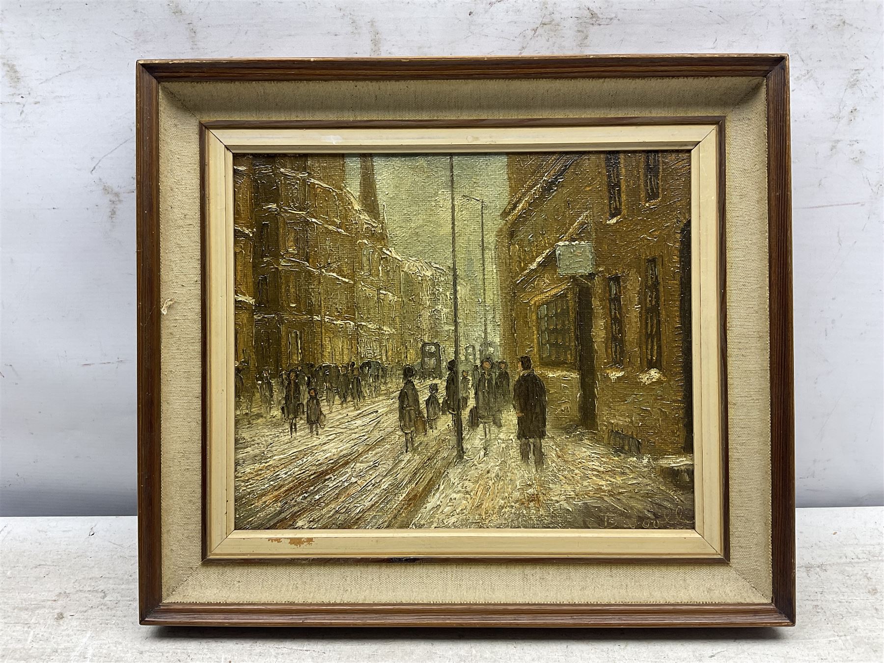 B Woolley (Northern British 20th century): 'Winter in the City - Manchester', oil on canvas laid on to panel signed and dated '77, 23cm x 28cm