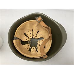 Two 1960s East Block Soviet style helmets - Czechoslovakian and Russian; both with liners (2)