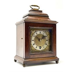 Late 20th century mahogany case bracket time-piece clock, sarcophagus top with handle, brass dial with Roman chapter ring and ornate mask cast spandrels, single train driven movement, raised on brass ball and claw feet
