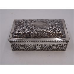 Victorian silver mounted cigarette box, of rectangular form, repousse decorated with ornate putti, floral, foliate and scroll detail, with a central blank cartouche to slightly domed, hinged cover, opening to reveal softwood lined compartmentalised interior,  hallmarked London 1888, maker's mark indistinct, H7cm