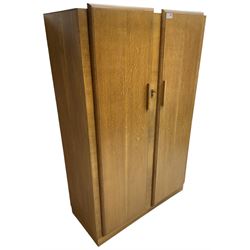 Early 20th century Art Deco period oak double wardrobe, the interior fitted with mirror, shelf and hanging rail