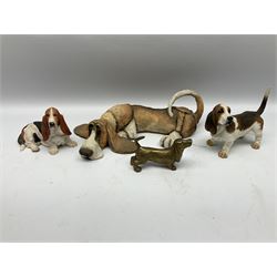 Beswick fireside labrador, model 2314, together with Lladro swan, model 6175, Border fine arts basset hound, model B0016A, Country Artists Mutts figure 'loafer basset' and two other dog figers