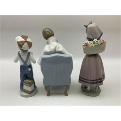 Three Lladro figures, comprising Boy from Madrid no 4898, Nature Bounty no 1417 and Purrfect Friends no 6512, all with original boxes, largest example H24cm