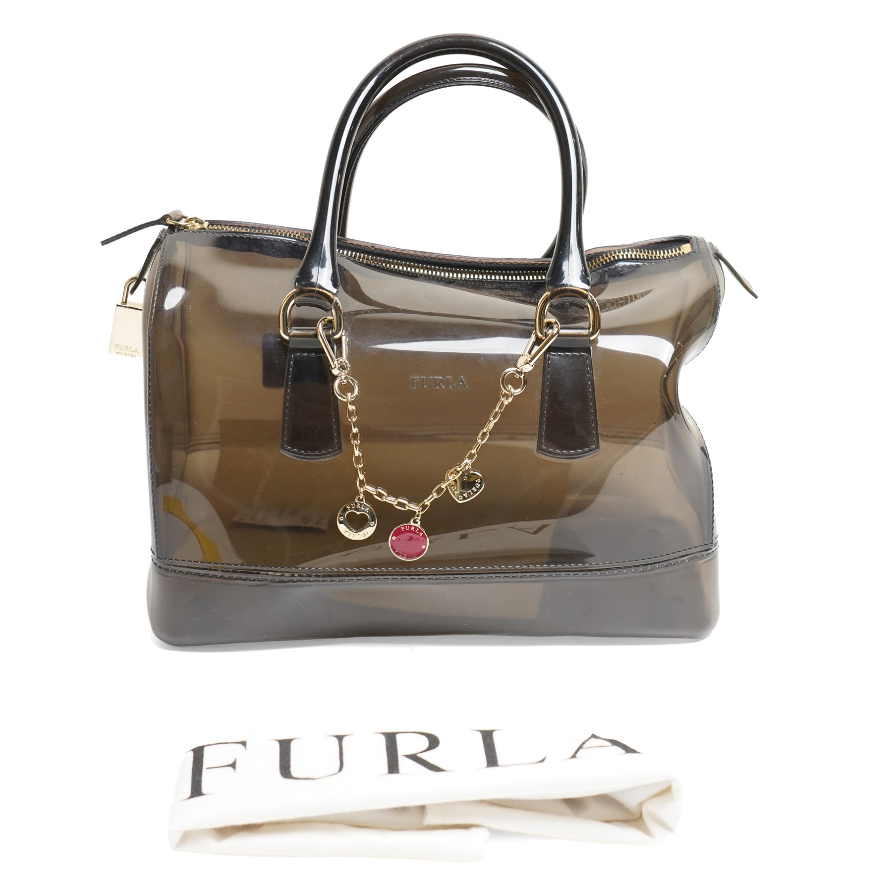 Furla - ‘Candy’ top-handle bag in smoky black transparent PVC, with rolled top handles, gold-tone hardware padlock, with front-hanging charm chain, with original Furla dust bag