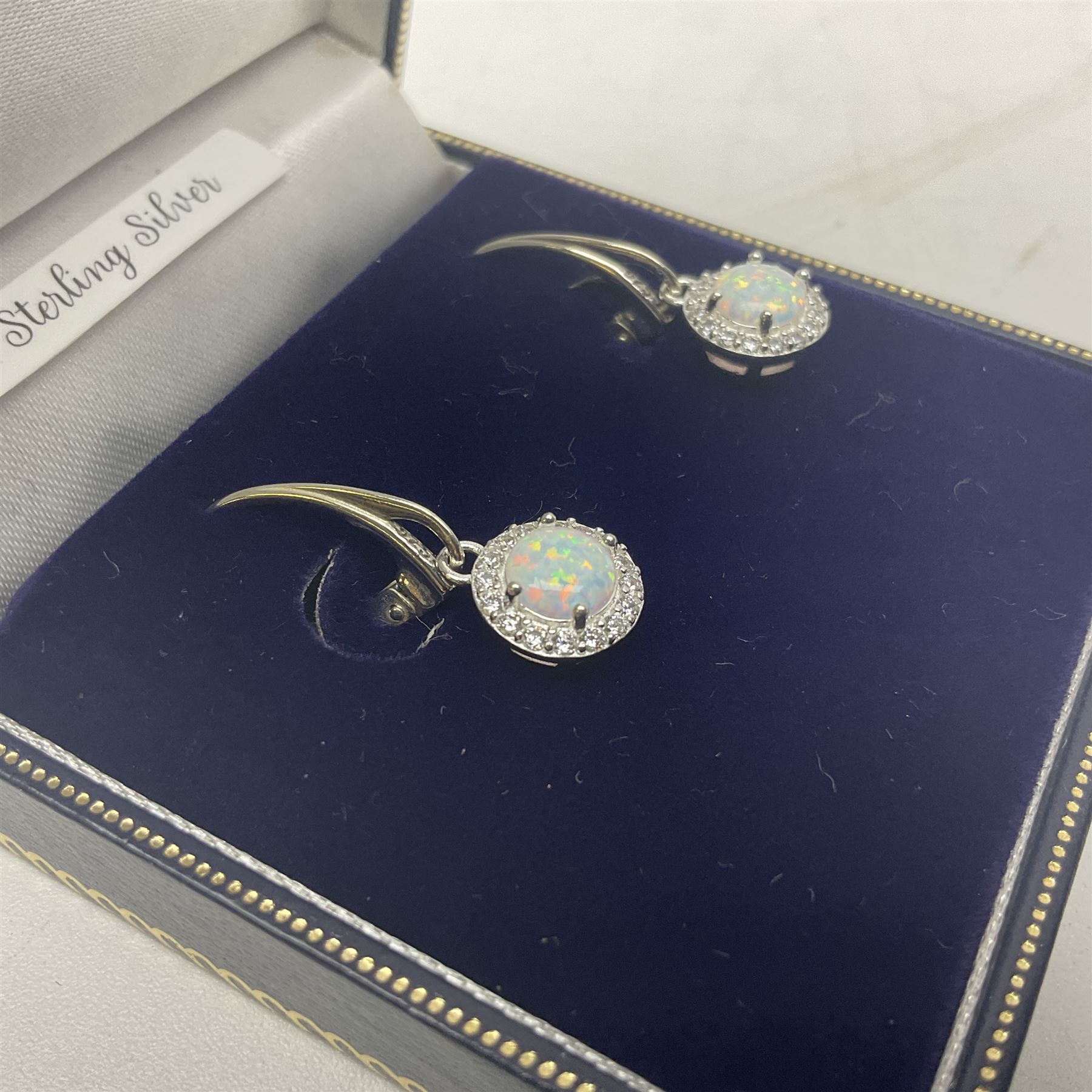 Pair of silver opal and cubic zirconia cluster pendant earrings, stamped 925, boxed 