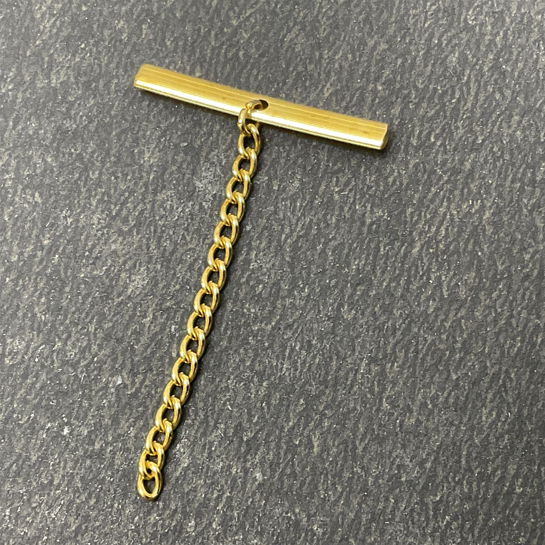 9ct gold Masonic Past Masters jewel, presented to 'W Bro Keith Leonard Hoggard by the bretheren of the Lodge St Andrew as a mark of esteem for valuable services rendered as worshipful master 1989-1990', hallmarked, together with a 9ct gold Masonic stick pin and stud