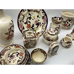 A group of Masons Ironstone Mandalay pattern wares, comprising large vase, planter with twin lug handles, three graduated plates, bowl, teapot, teacup and saucer, jug, smaller jug, open sucrier, small pot and cover, pair of candlesticks, small mantel clock, and pin dish. 