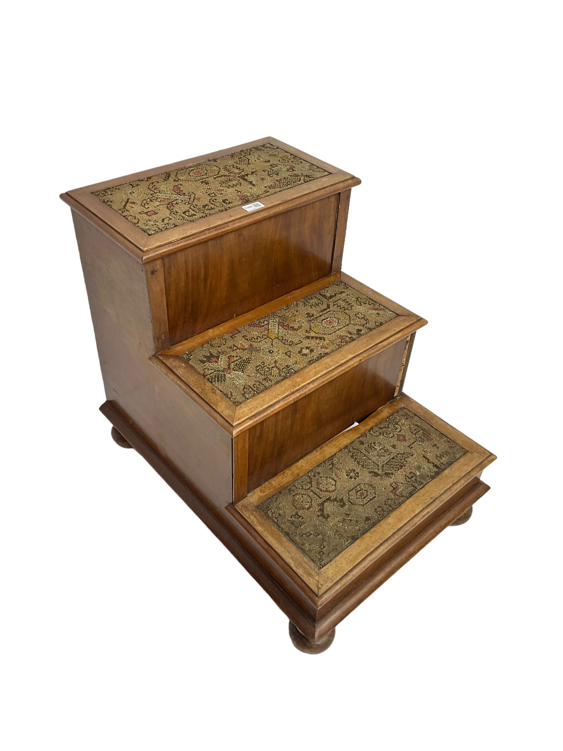 19th century mahogany step commode, pull-out action to reveal commode, the top with hinged lid, on turned feet