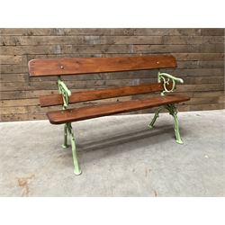 Cast iron and wood slate bench painted in green