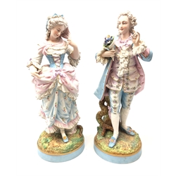  Pair of large 19th century Meissen bisque porcelain figures depicting a young lady and gentleman in 18th century dress, impressed to base A.M and painted crossed swords mark, H47cm   