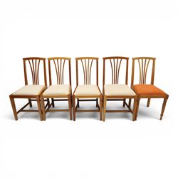 Knightman - set of nine cherrywood dining chairs, with fan splat backs and upholstered seats, raised on square legs joined by stretchers, comprising chairs of slight differing widths and one chair with turned front legs and orange upholstery and no Knight carving, the rest with recessed carved knight trademark, by Horace Knight of Old Mill Furniture, Balk near Thirsk 