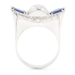Platinum sapphire and diamond abstract design dress ring, pave set with eighteen old cut and round brilliant cut diamonds, with two mixed cut sapphires at each end, in a curved design setting, total sapphire weight approx 2.68 carat, total diamond weight approx 1.95 carat, with World Institute Report