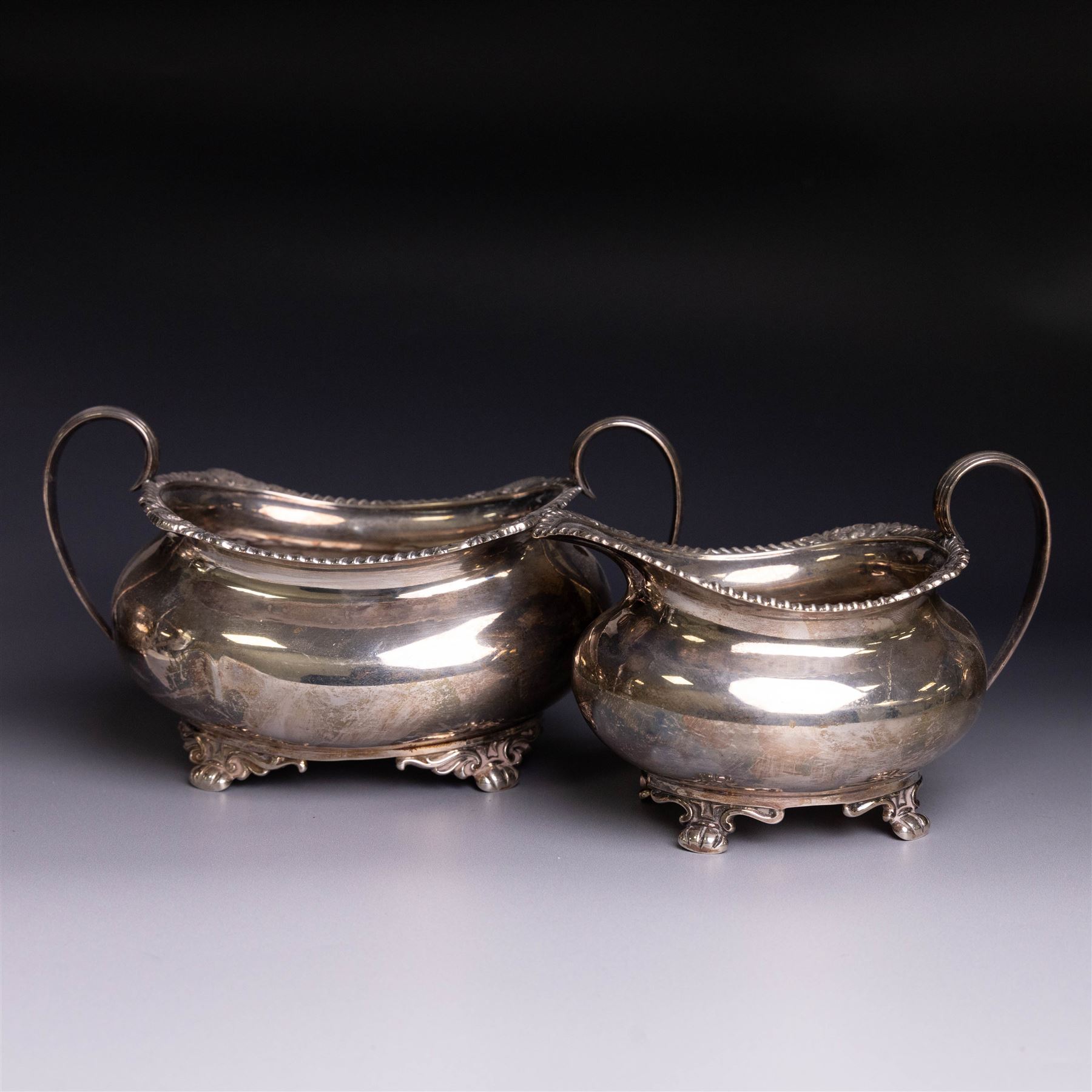 Victorian four piece silver tea service, comprising teapot, hot water pot, open sucrier and cream jug, each of baluster form and decorated with a frieze of neo-classical figures on a textured ground, the teapot and hot water pot with Roman helmet finials and ivory insulated handles, Roberts & Belk, Sheffield 1872, tallest including handle H32cm
