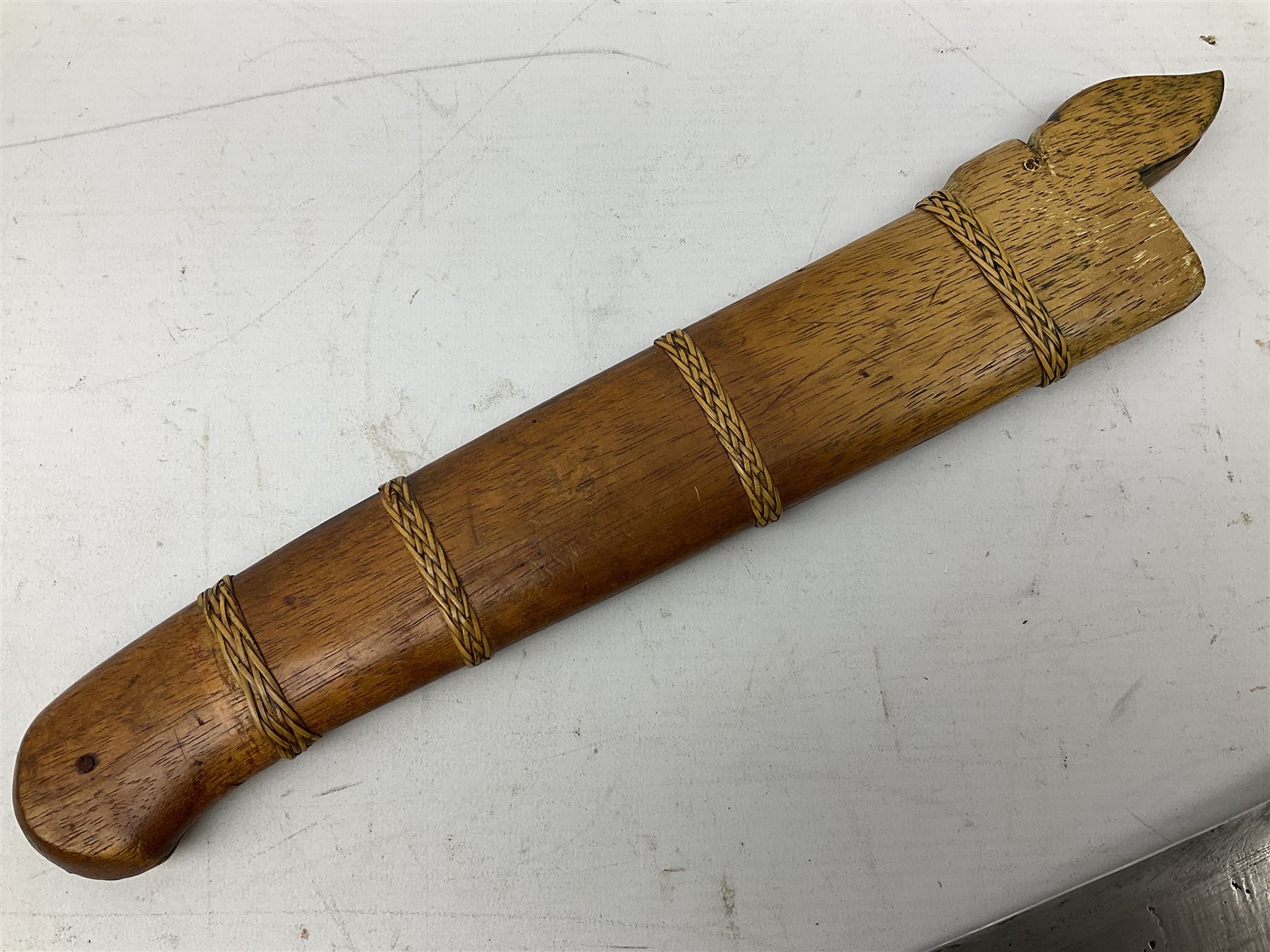 Malaysian parang survival knife the 29cm steel blade with character marks, cane bound teak grip carved with a stylised turtle head to the pommel, with matching teak scabbard L46cm overall