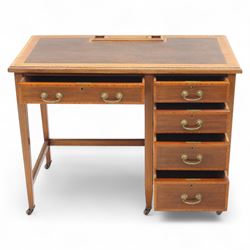 Early 20th century Edwardian mahogany single pedestal writing desk, the crossbanded rectangular top inset with brown leather, fitted with five drawers with brass swan neck handles, upon square tapering supports terminating in brass castors