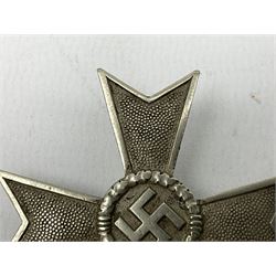 Two WW2 German War Merit Crosses, one First Class without swords, pinned and one Second Class with swords and ribbon (2)