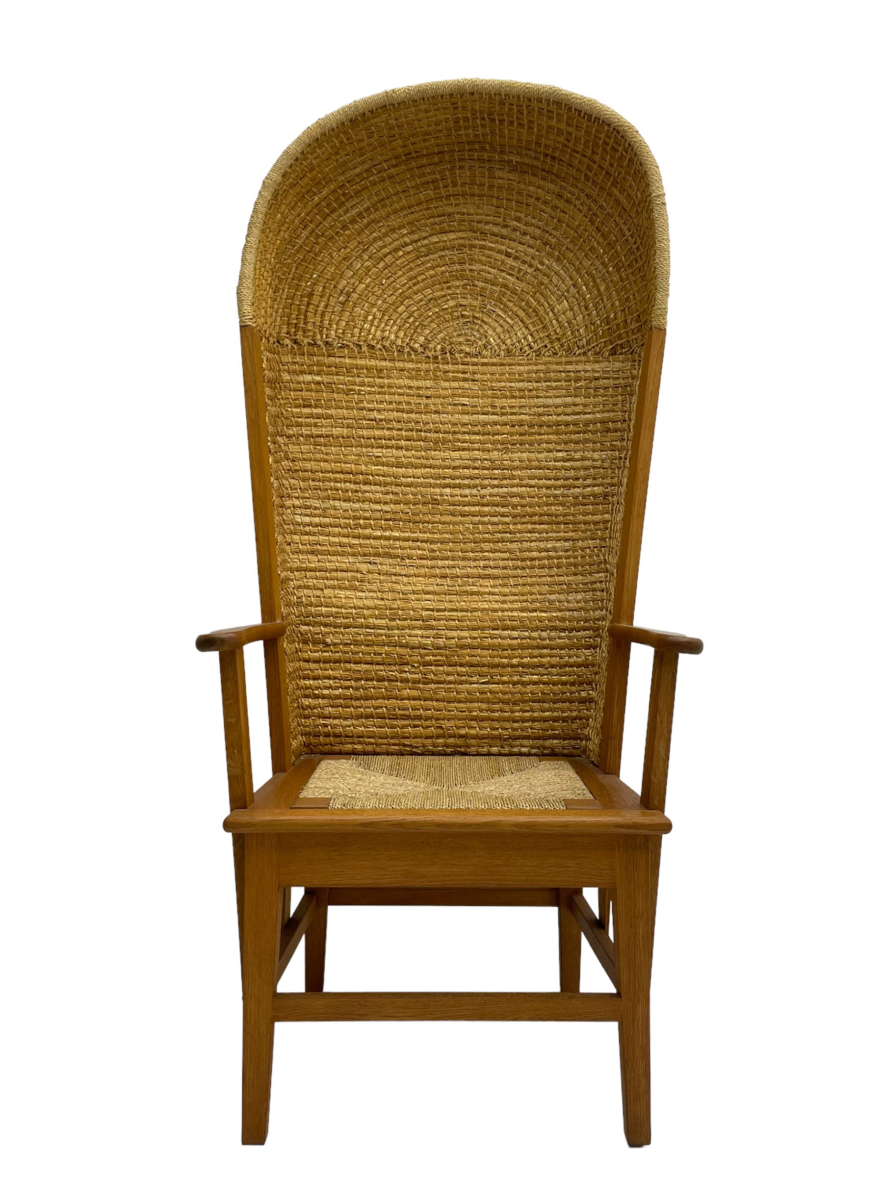 Reynold Eunson (1932–1978) for David Munro Kirkness, Kirkwall, Orkney - oak framed Orkney chair, woven straw canopy back, drop-in rush seat, the arm terminals carved with scrolls, on square tapering supports joined by plain stretchers, the front rail inscribed with makers marks