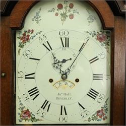 John Hall of Beverley - George III oak eight-day longcase clock, the painted arched dial with subsidiary seconds and date aperture, floral decoration, the case with pagoda top, pierced fretwork panel, brass ball finials, fluted pilasters and arched trunk door