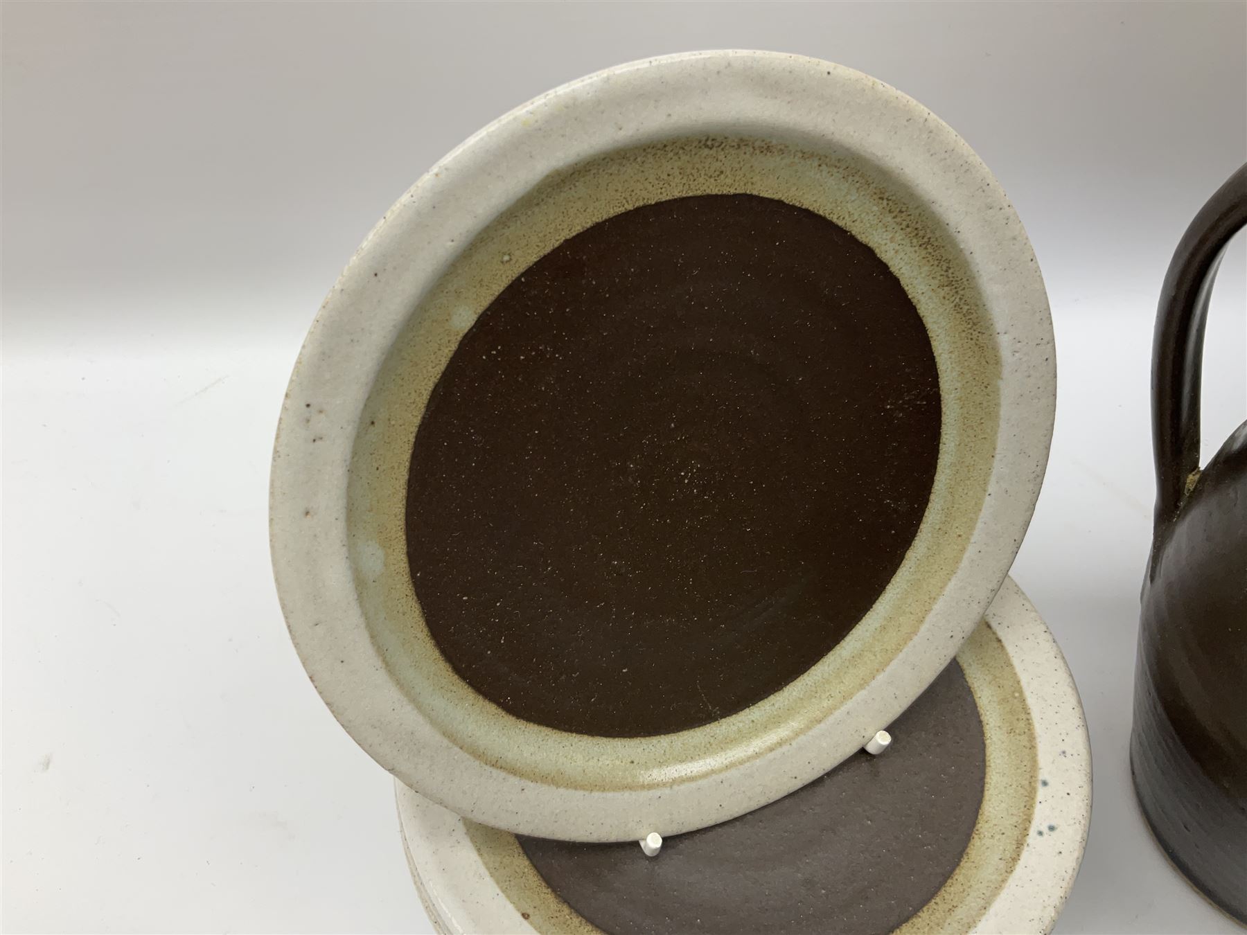 Marianne De Trey (British 1913-2016) stoneware coffee service for twelve, together with a large deep stoneware footed bowl and ladle with wood handle, all decorated in Manganese 'Pattern 1' with impressed shell marks, bowl D27cm