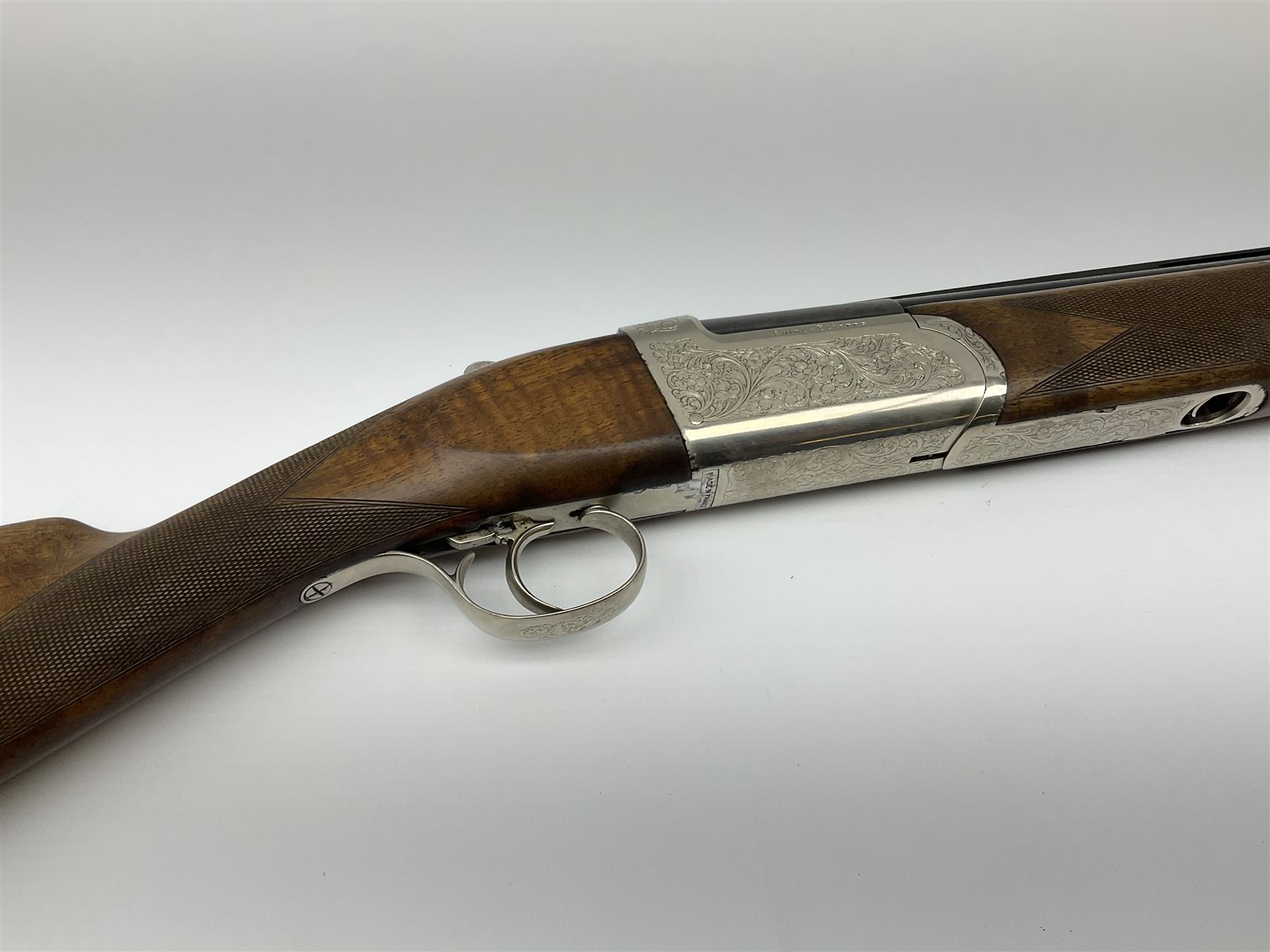 French Verney Carron 12-bore over-and-under double barrel boxlock ejector sporting gun, 71cm barrels, walnut stock with chequered grip and fore-end and thumb safety, serial no.336224X, L115cm RFD ONLY AS BARRELS MARGINALLY IN PROOF
