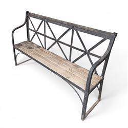 19th century and later Estate made wrought iron strapwork garden bench, the weathered wooden cresting rail over X-form strapwork back and slatted wooden seat