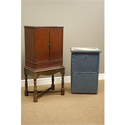  Early 20th century mahogany music cabinet on later stand (W49cm, H106cm, D32cm), and a Lloyd Loom type linen bin   
