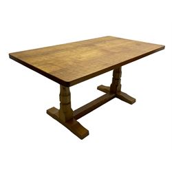 Mouseman - oak dining table, adzed rectangular top on twin octagonal pillar supports, sledge feet united by floor stretcher, by the workshop of Robert Thompson, Kilburn 