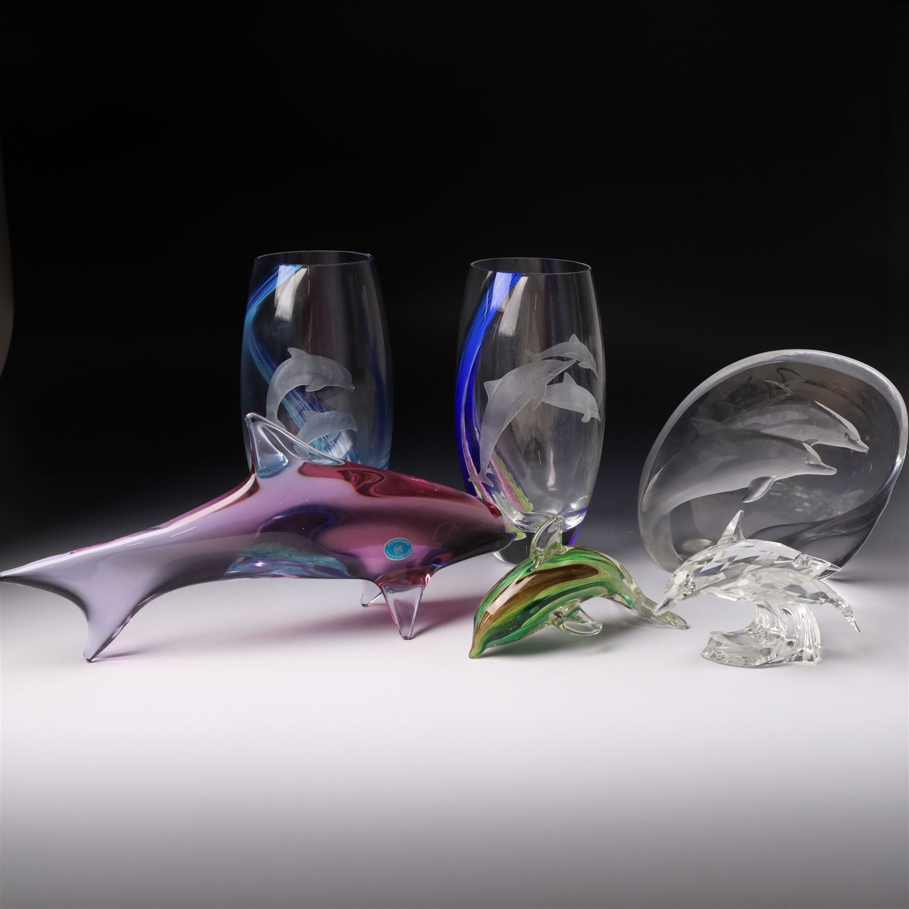 Mats Jonasson Signature Collection glass dolphin, two Caithness glass vases with dolphin decoration, Bohemia glass dolphin, Swarovski dolphin and other dolphin items