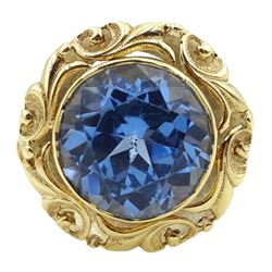 18ct gold single stone round synthetic blue spinel ring, with pierced leaf border