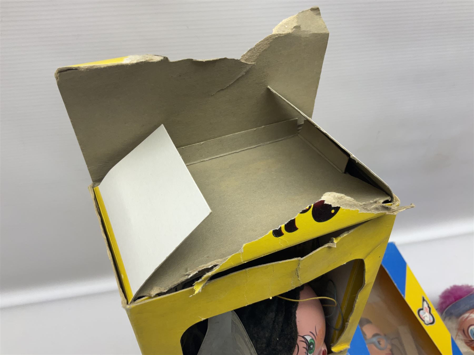 Three Pelham puppets - 'Brains' from Thunderbirds in blue/yellow box; Witch in yellow window box; and Macboozle in brown box (3)