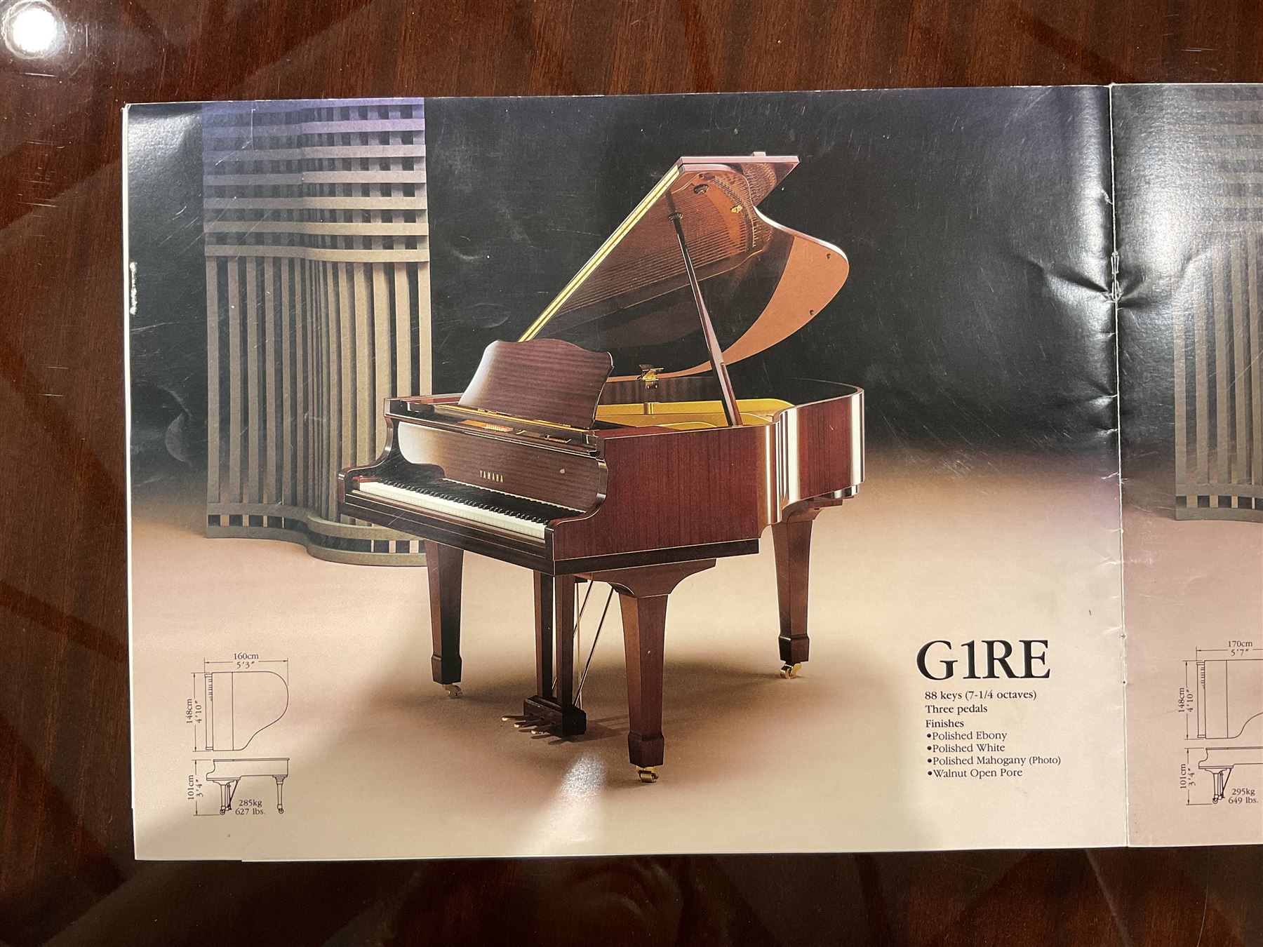 Yamaha - Baby Grand piano in mahogany polyester finish case,  G1 model, serial No 4741647, cast overstrung frame with 88 keys and seven octave compass, original stringing, tuning pins, hammers, dampers and felts, sostenuto, una corda and sustain pedals, with a solid music desk and tapered legs on brass castors.   