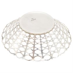 Three mid 20th century silver bowls, including two circular examples with pierced sides and a square example with twin handles, all hallmarked