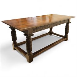 17th century revival oak refectory table, rectangular plank top above a scallop shell carved frieze and baluster turned legs carved with scallop shell and Gothic tracery, joined by stretchers